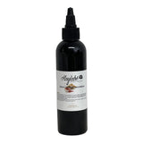 Sérum ayurvédique revitalisant pour nourrir et favoriser la croissance des cheveux crépus.